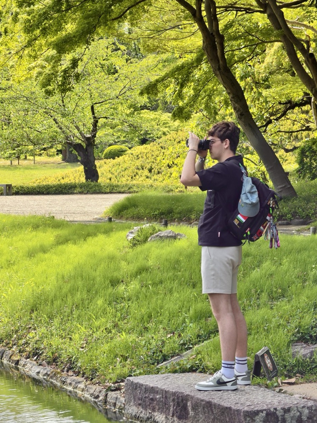 Bram photographing in a park